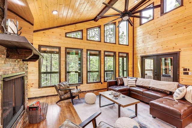 living room with wooden ceiling and wood walls