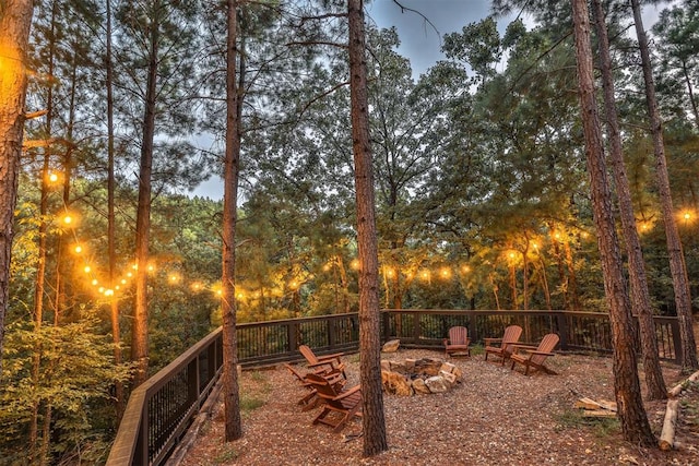 view of yard featuring an outdoor fire pit