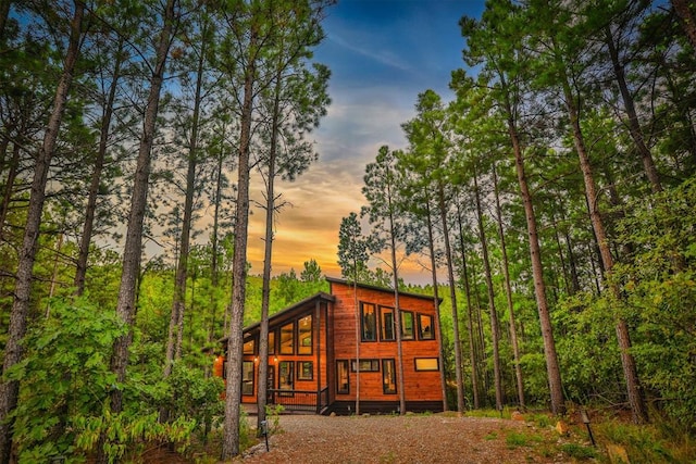 view of back house at dusk