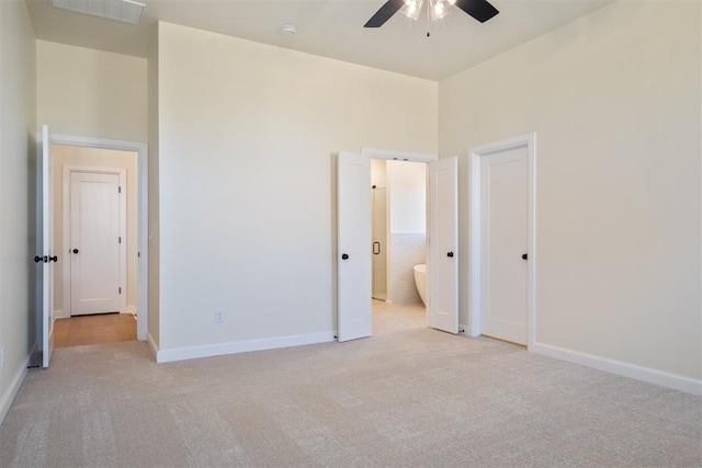 1103 Mount Irving Way, Norman, OK 73071 - unfurnished bedroom with light colored carpet, connected bathroom, baseboards, and ceiling fan