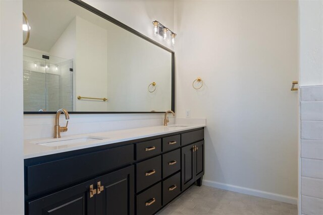1103 Mount Irving Way, Norman, OK 73071 - bathroom featuring double vanity, a stall shower, tile patterned flooring, and baseboards