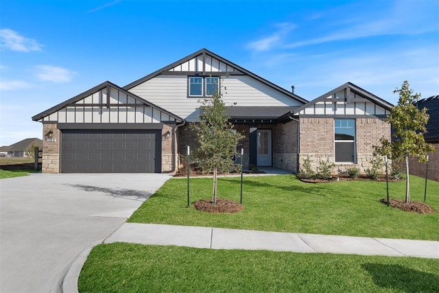 1103 Mount Irving Way, Norman, OK 73071 - tudor home with a garage, a front lawn, concrete driveway, board and batten siding, and brick siding