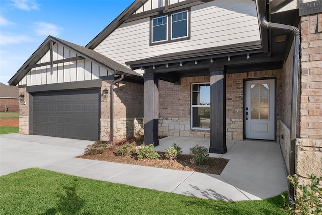 1103 Mount Irving Way, Norman, OK 73071 - view of front of property featuring board and batten siding, a garage, concrete driveway, brick siding, and stone siding
