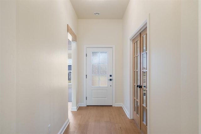 1103 Mount Irving Way, Norman, OK 73071 - doorway featuring light wood finished floors and baseboards