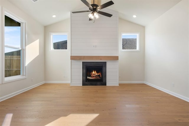 1103 Mount Irving Way, Norman, OK 73071 - unfurnished living room featuring lofted ceiling, light wood finished floors, a large fireplace, ceiling fan, and baseboards