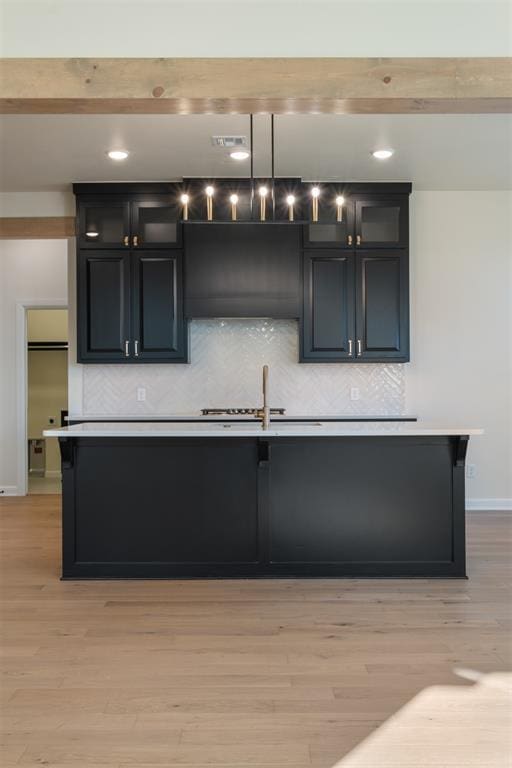 1103 Mount Irving Way, Norman, OK 73071 - kitchen featuring a sink, decorative backsplash, light countertops, baseboards, and recessed lighting