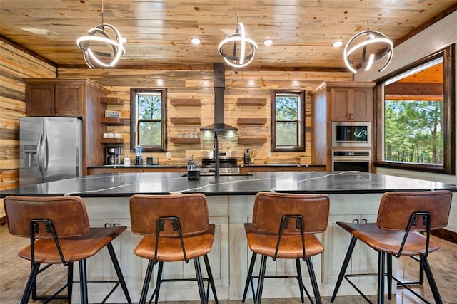 kitchen with appliances with stainless steel finishes, wood walls, and wood ceiling