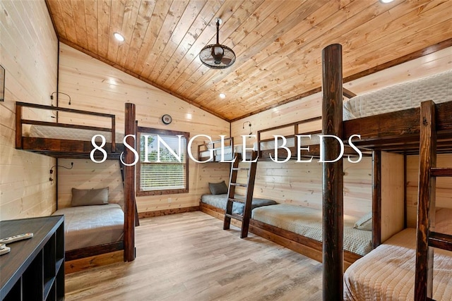 unfurnished bedroom featuring wood-type flooring, vaulted ceiling, wooden ceiling, and wood walls