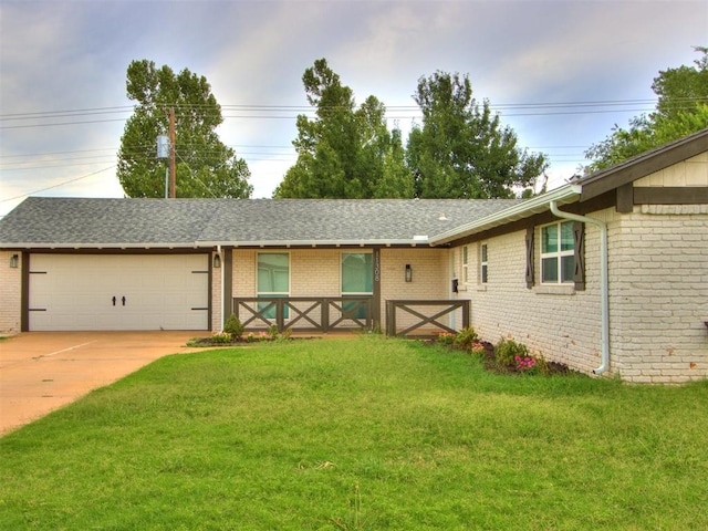 ranch-style home with a front yard and a garage