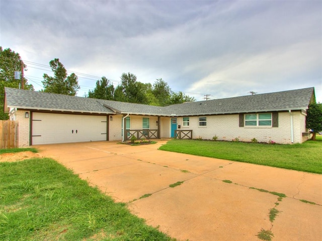 ranch-style house with a front yard and a garage