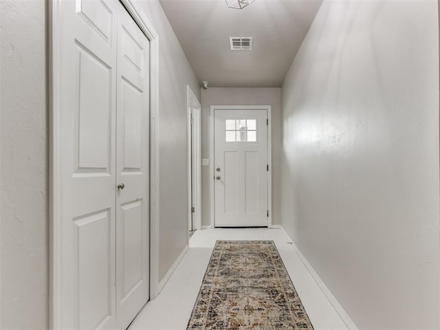 doorway featuring light tile patterned flooring