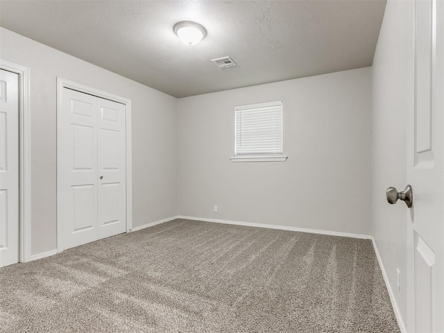 unfurnished bedroom with carpet floors