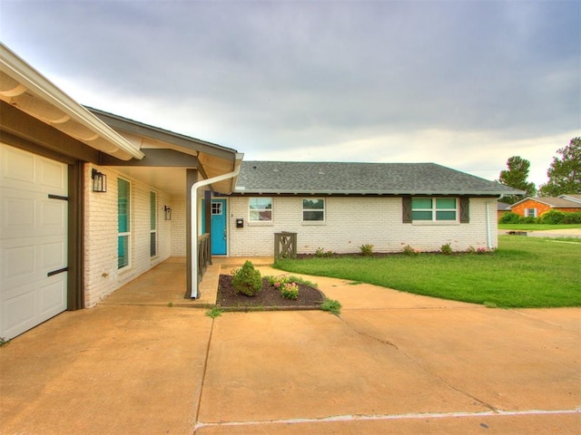 view of front of home with a garage and a front yard