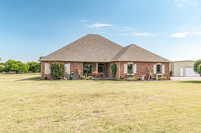 12600 SW 58th St, Mustang, OK 73064 - ranch-style home with a garage, an outdoor structure, and a front yard