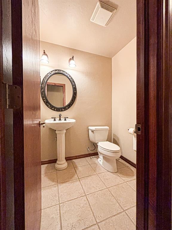 12600 SW 58th St, Mustang, OK 73064 - bathroom with tile patterned flooring and toilet
