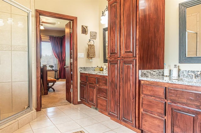 12600 SW 58th St, Mustang, OK 73064 - bathroom with tile patterned floors, vanity, and a shower with shower door