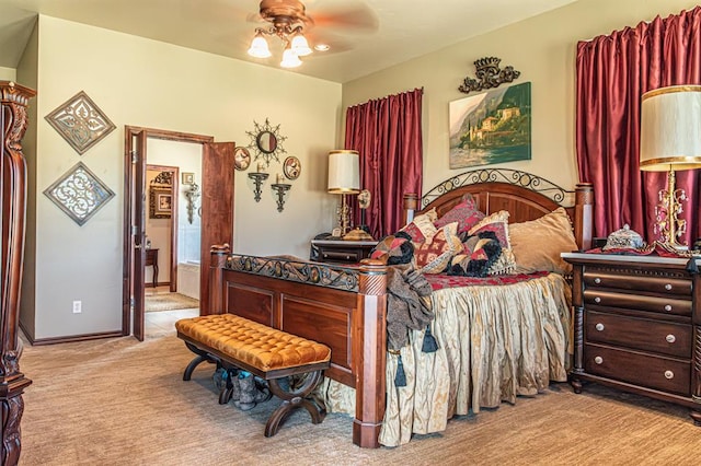 12600 SW 58th St, Mustang, OK 73064 - carpeted bedroom featuring ceiling fan and ensuite bath