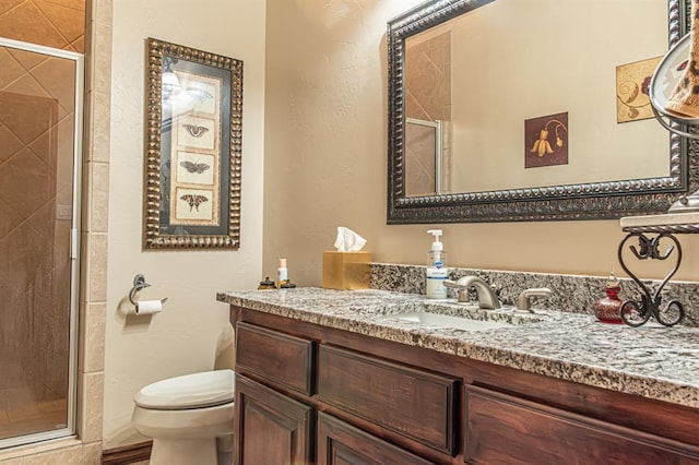 12600 SW 58th St, Mustang, OK 73064 - bathroom featuring walk in shower, vanity, and toilet