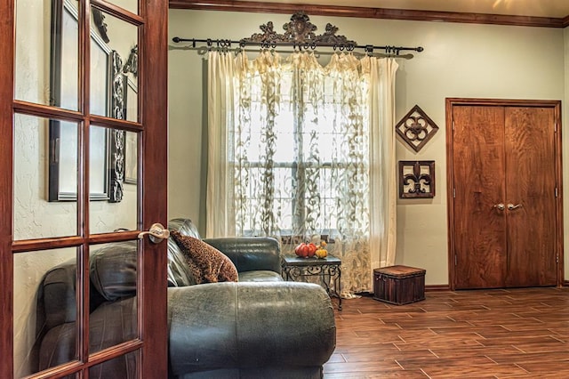 12600 SW 58th St, Mustang, OK 73064 - living area with hardwood / wood-style floors, a healthy amount of sunlight, and ornamental molding
