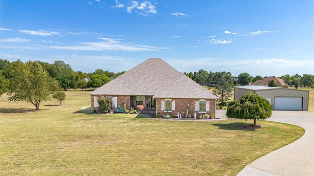 12600 SW 58th St, Mustang, OK 73064 - view of front of house with an outdoor structure, a front yard, and a garage