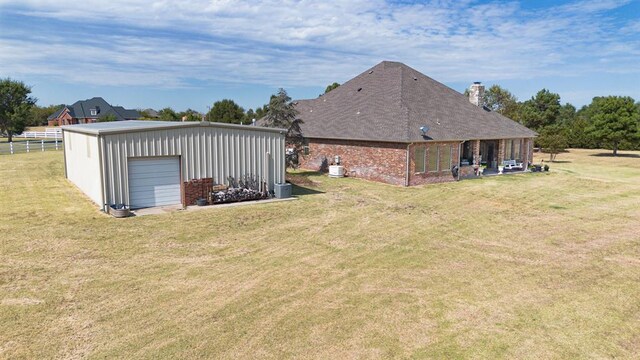 12600 SW 58th St, Mustang, OK 73064 - exterior space featuring an outdoor structure and a garage