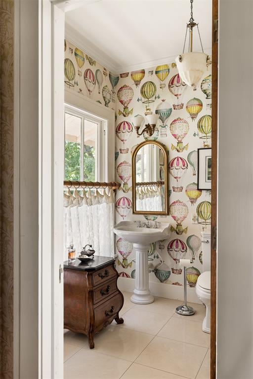 bathroom featuring tile patterned flooring and toilet