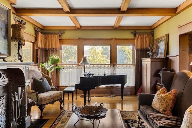 sitting room with beamed ceiling, hardwood / wood-style floors, and coffered ceiling