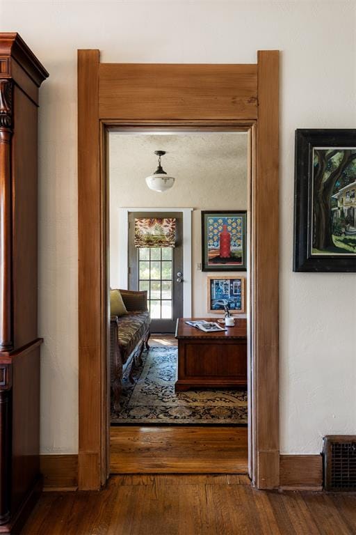 hallway featuring hardwood / wood-style flooring