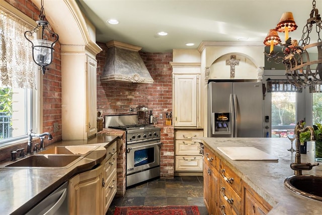 kitchen with sink, premium range hood, stainless steel appliances, and a wealth of natural light