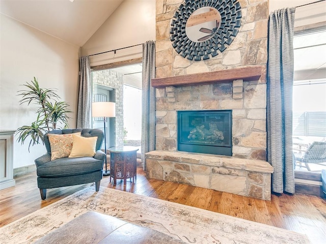 1205 Cobblestone Ln, Kingfisher, OK 73750 - living room with wood finished floors, high vaulted ceiling, and a fireplace