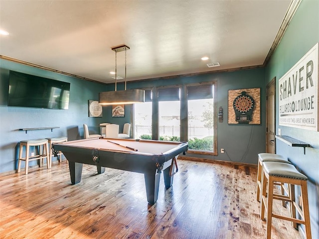 recreation room featuring light wood-type flooring, crown molding, and pool table