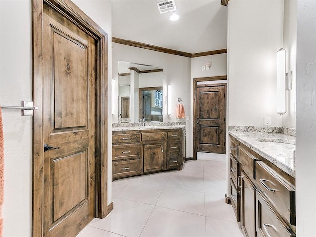 1205 Cobblestone Ln, Kingfisher, OK 73750 - full bath featuring two vanities, ornamental molding, and tile patterned flooring