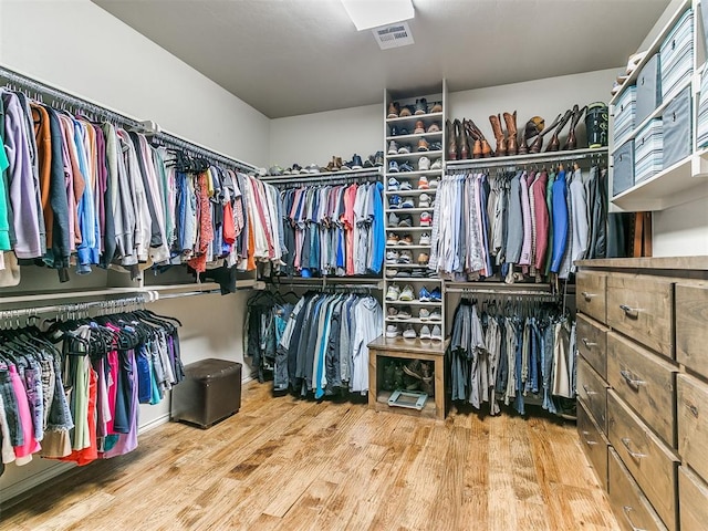 walk in closet featuring hardwood / wood-style floors