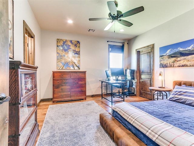 bedroom featuring light hardwood / wood-style floors and ceiling fan