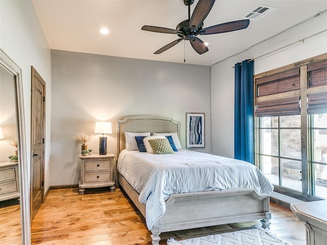 bedroom featuring ceiling fan and light hardwood / wood-style flooring