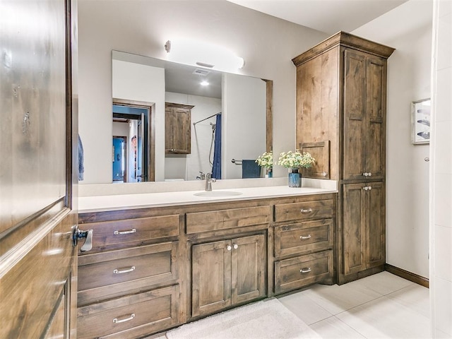 1205 Cobblestone Ln, Kingfisher, OK 73750 - bathroom featuring double vanity and tile patterned floors