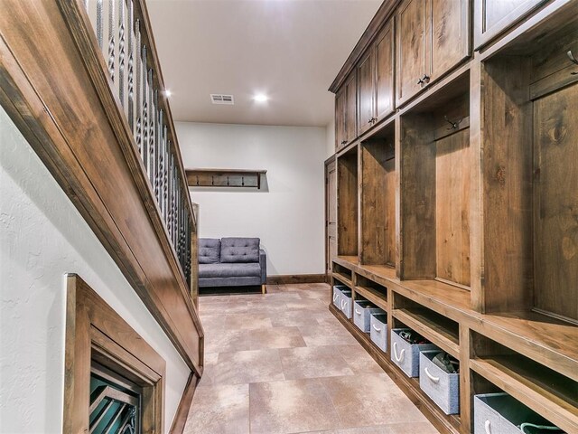 1205 Cobblestone Ln, Kingfisher, OK 73750 - mudroom with baseboards and stone finish floors