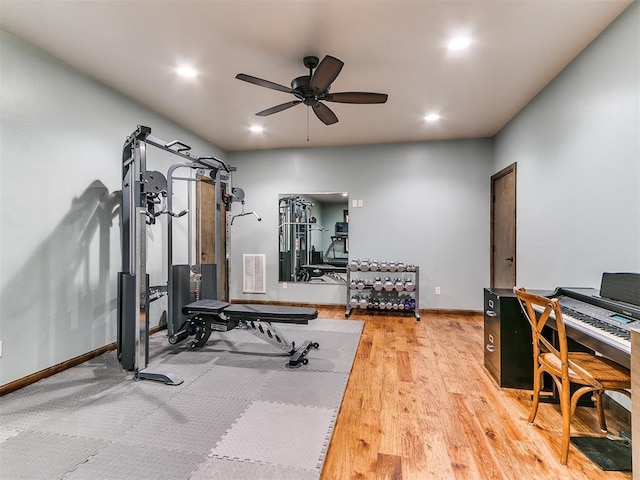 workout area with ceiling fan and hardwood / wood-style flooring