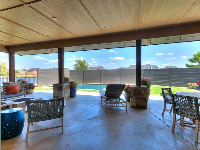 view of patio with an outdoor fire pit