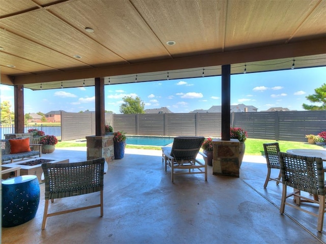 1205 Cobblestone Ln, Kingfisher, OK 73750 - fenced backyard with an outdoor fire pit, a patio area, and outdoor dining space