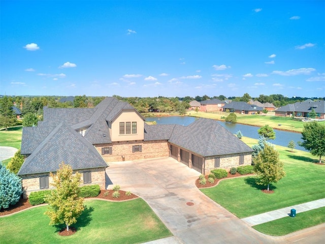 bird's eye view with a residential view and a water view