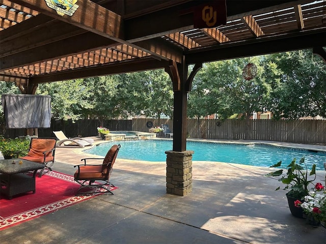 view of pool featuring an in ground hot tub and a patio