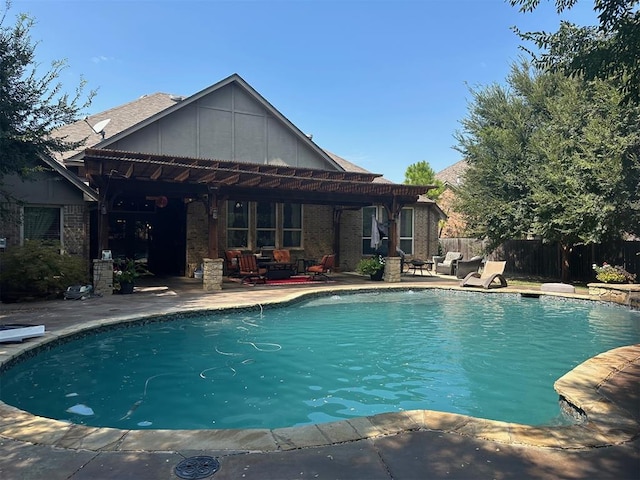 view of swimming pool with a diving board and a patio area