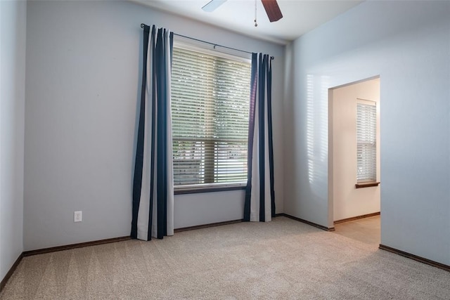 carpeted empty room with ceiling fan