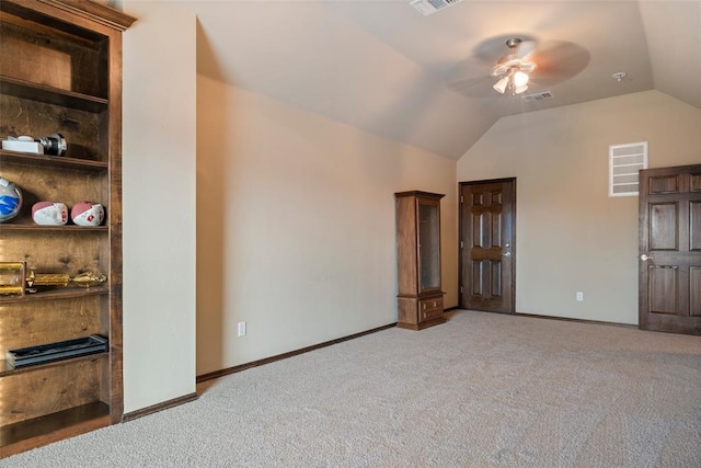 unfurnished bedroom with light carpet, ceiling fan, and lofted ceiling