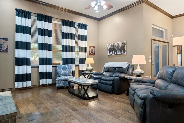 living room featuring crown molding, ceiling fan, and wood-type flooring