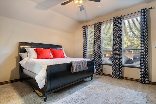 bedroom with ceiling fan, light colored carpet, and lofted ceiling