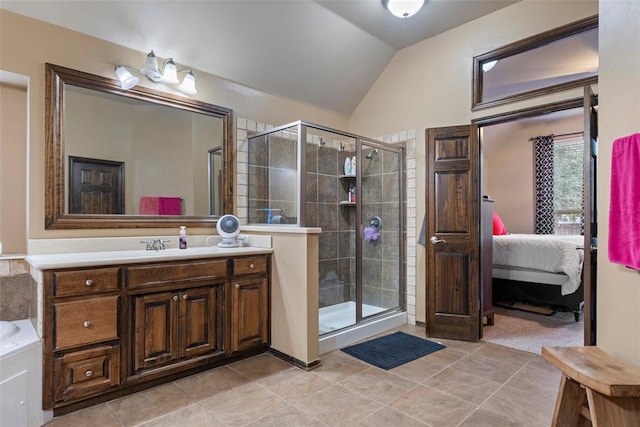 bathroom featuring tile patterned floors, vanity, lofted ceiling, and walk in shower