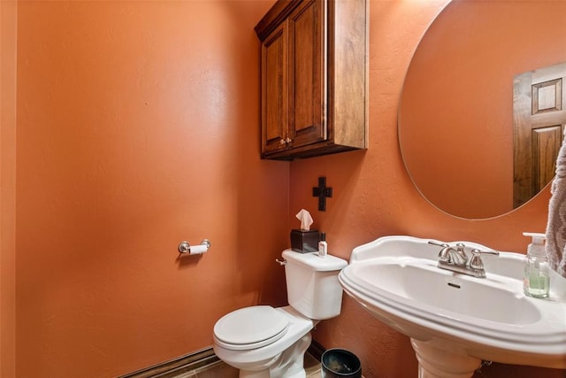 bathroom featuring toilet and sink