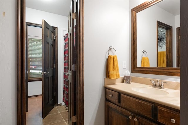 bathroom featuring tile patterned flooring and vanity